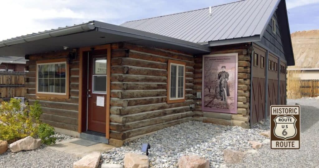 Historic Palisade History Museum log building in Palisade, Colorado, a free museum along US Route 6 preserving local agricultural and mining history.